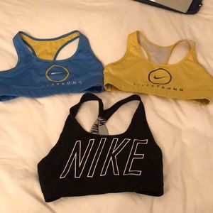 3 medium sized sports bras blue, black, yellow